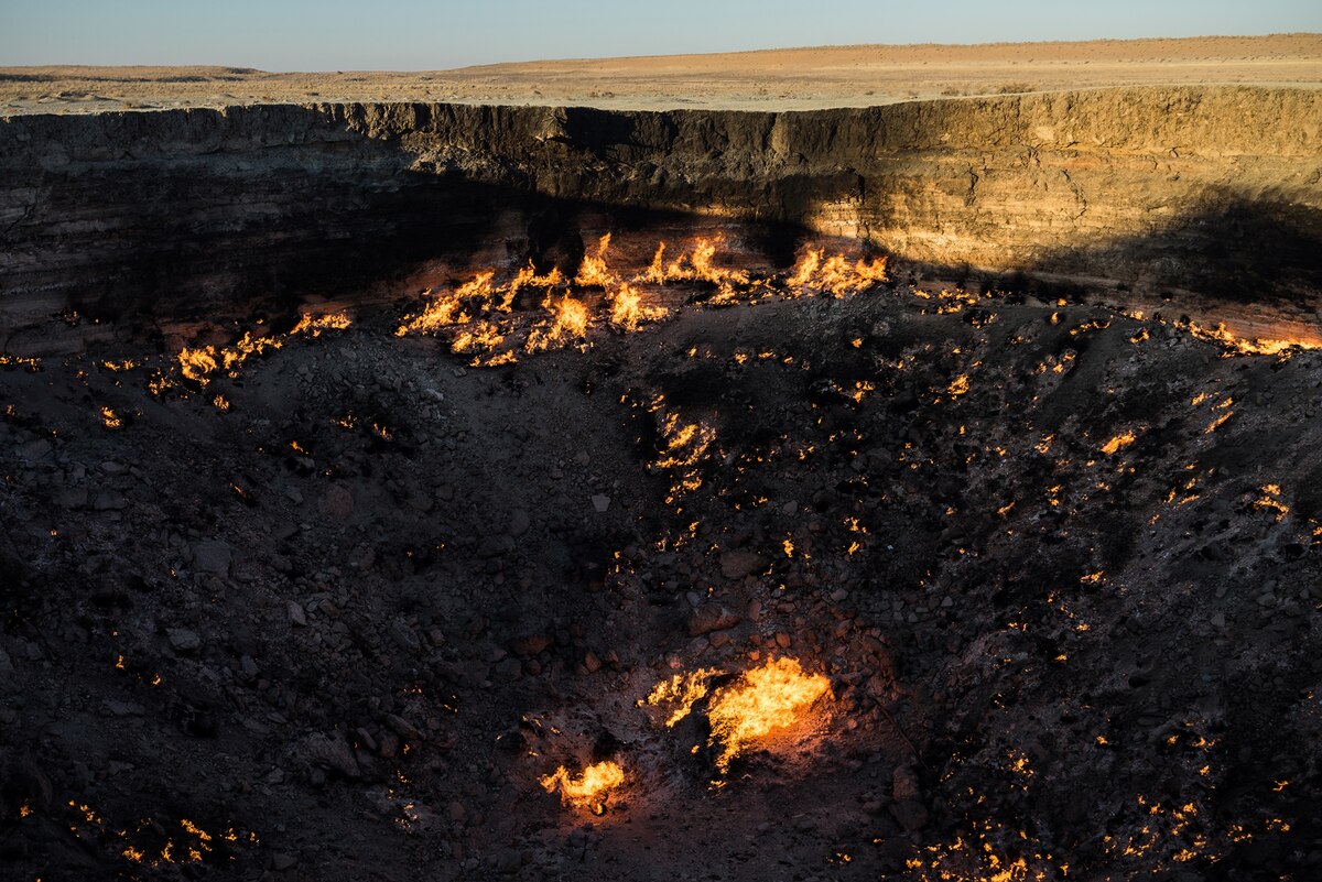 The burning Darbaza crater.  In 2013, National Geographic Explorer George Korounis entered the crater for 17 minutes to collect scientific samples.  (PHOTOGRAPH BY GILES CLARKE, GETTY IMAGES)